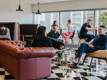 Coworking at 155 North Wacker, Chicago, where clients network and connect in a vibrant, professional environment.